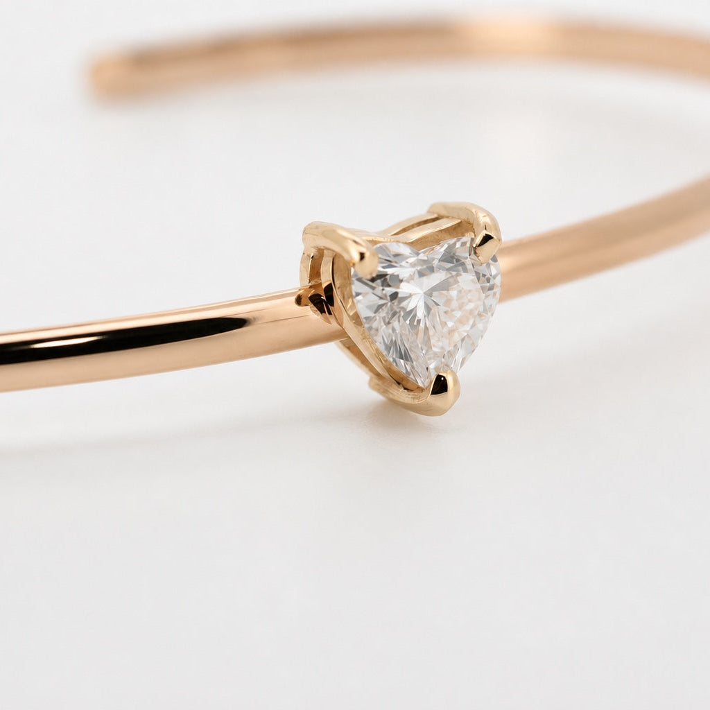 Heart-shaped lab-grown diamond open bangle in 14K yellow gold, left three-quarter view