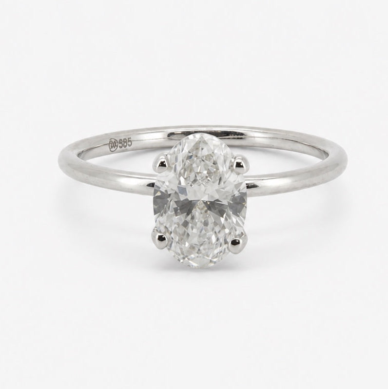 Oval solitaire ring in 14K gold, front view