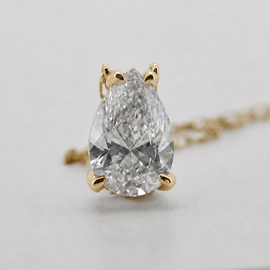 Yellow-gold visualization of the pear-cut diamond pendant necklace, front macro view #Metal_14K Yellow Gold