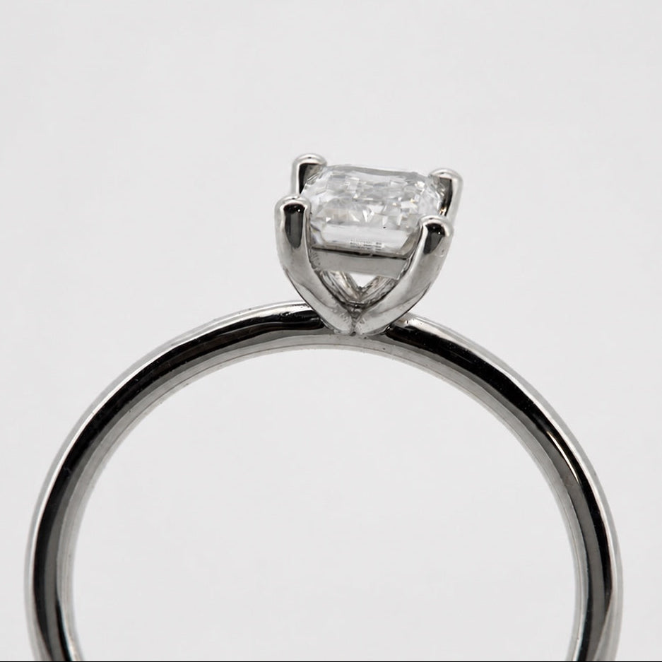 Emerald-cut solitaire engagement ring in 14K white gold, end-on basket profile #Metal_14K White Gold