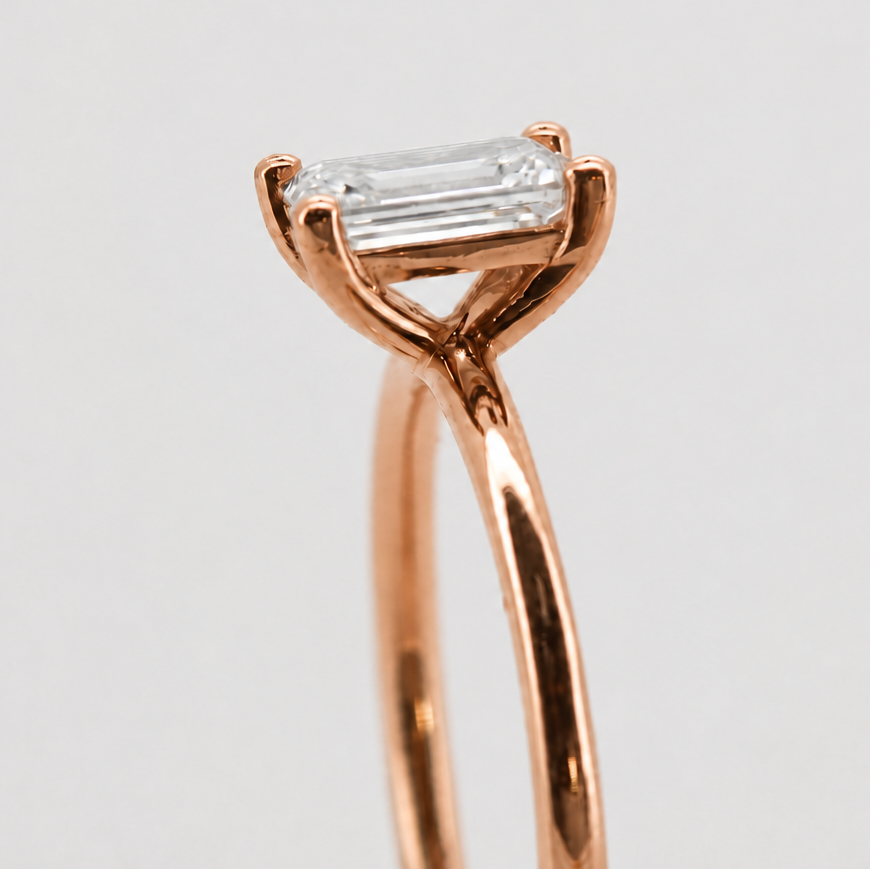 Rose-gold visualization of the emerald-cut solitaire engagement ring, side basket detail #Metal_14K Rose Gold