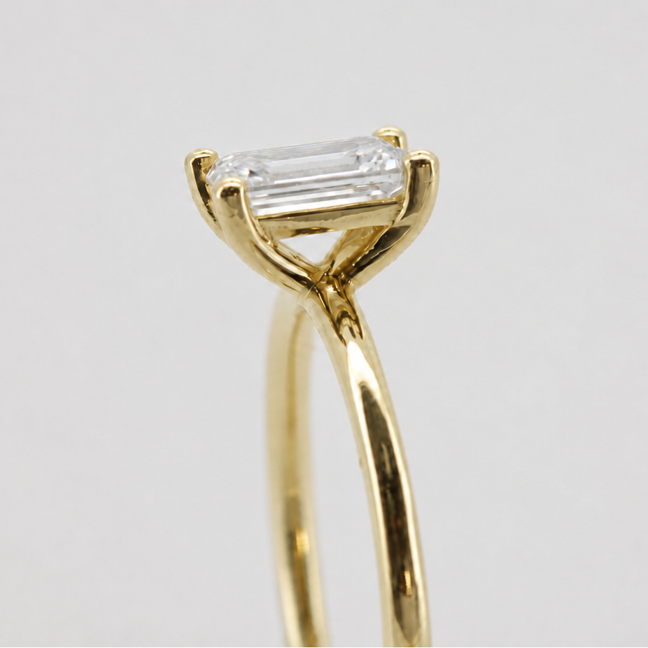 Yellow-gold visualization of the emerald-cut solitaire engagement ring, side basket detail #Metal_14K Yellow Gold