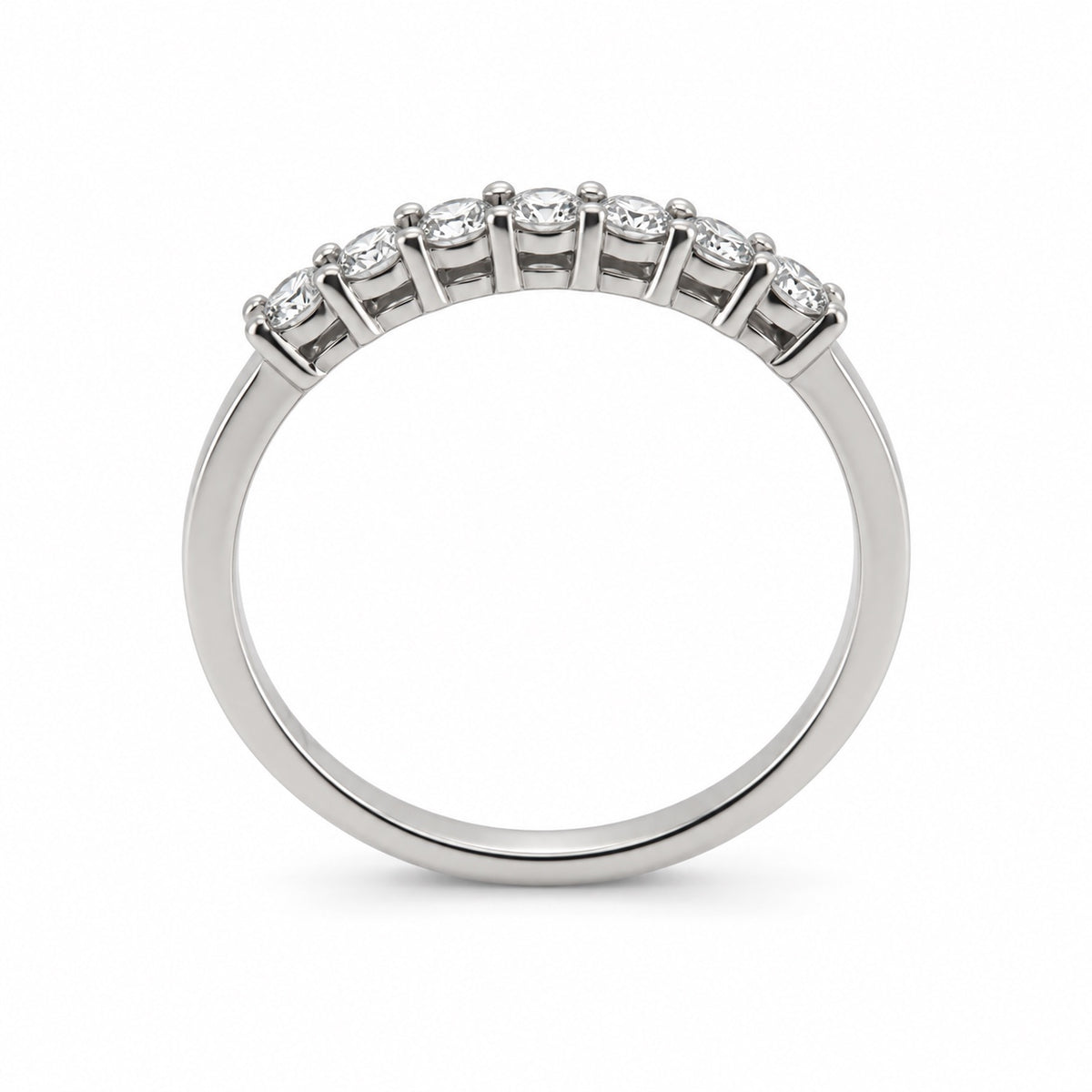 Seven-stone round ring in white-tone metal, rear profile view