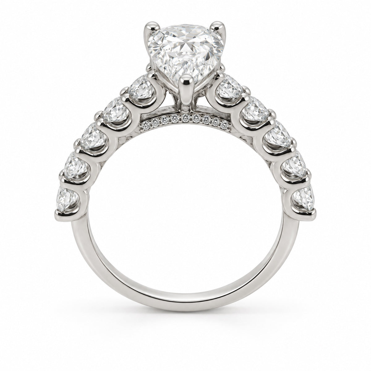 Pear solitaire engagement ring with stone-set band in 14K white gold, rear profile view