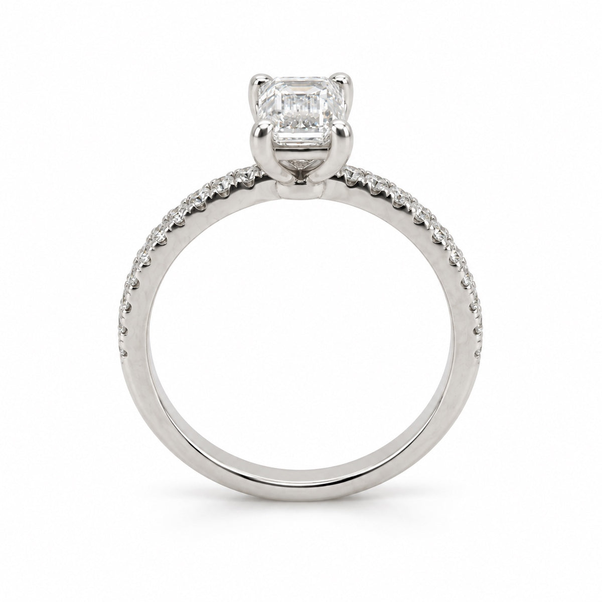 Emerald solitaire engagement ring with stone-set band in 14K white gold, rear profile view
