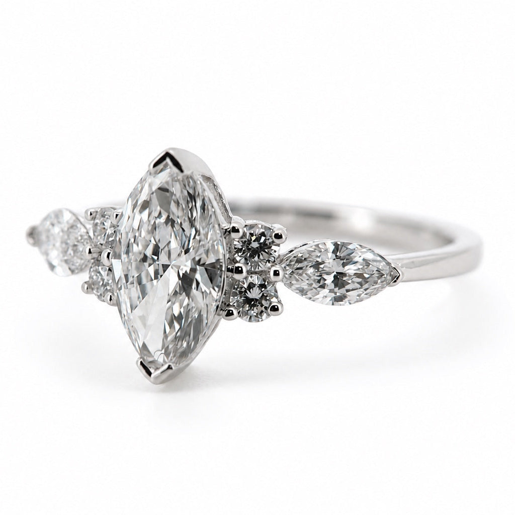 Right three-quarter view of the marquise and pear three-stone ring