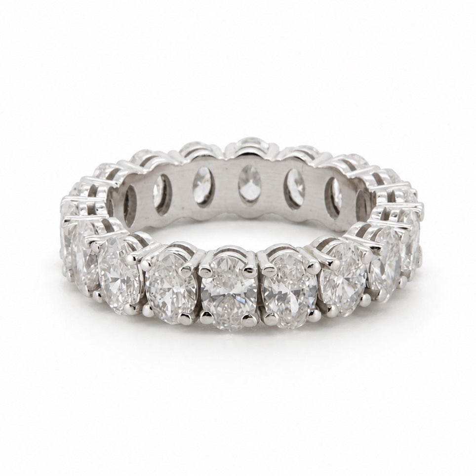 Round full-eternity ring in 14K gold, front three-quarter view