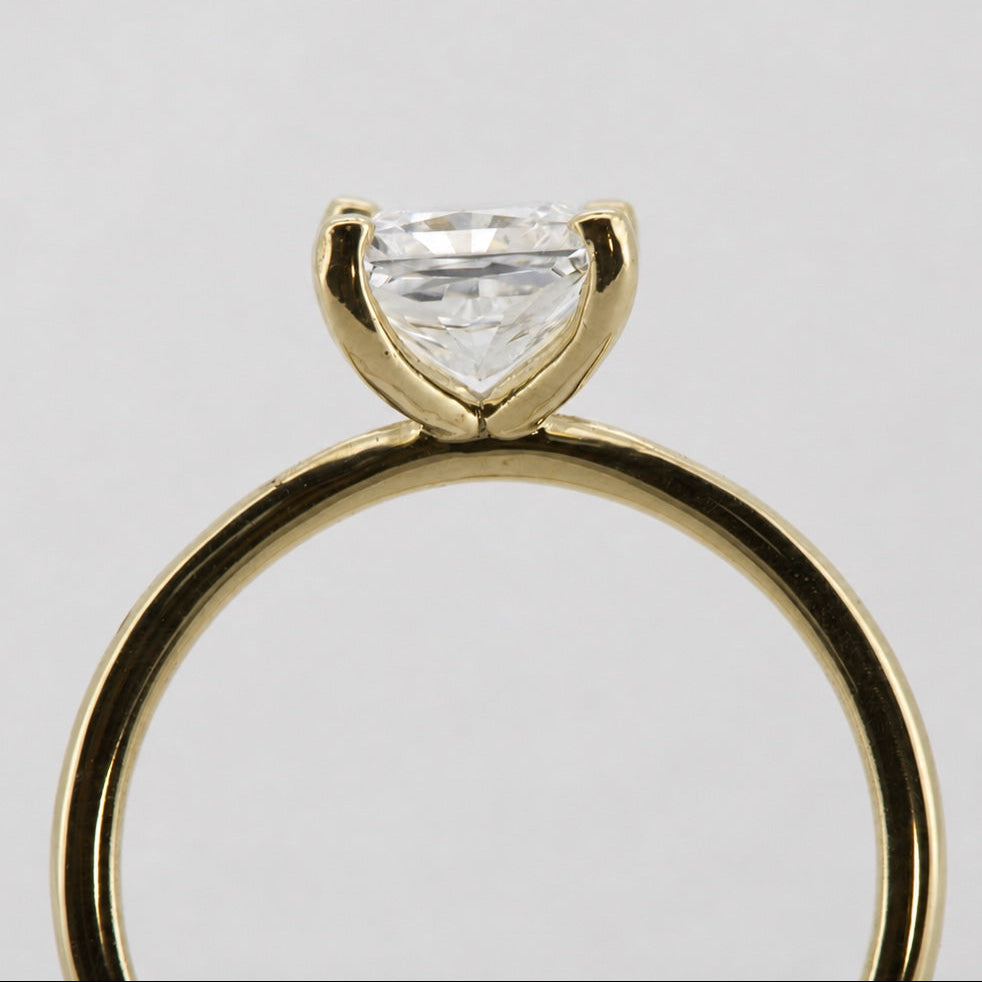 Princess solitaire engagement ring in 14K yellow gold, rear view