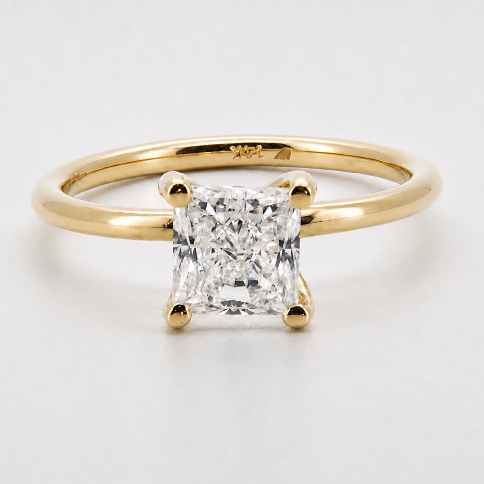 Princess solitaire engagement ring in 14K yellow gold, front view