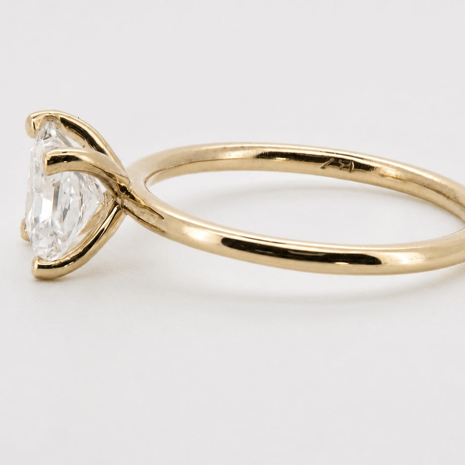Princess solitaire engagement ring in 14K yellow gold, side profile
