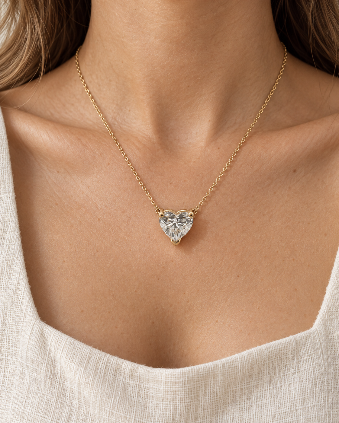 Yellow-gold heart solitaire necklace worn with the pendant facing forward — AI-generated wearing illustration. SKU 10059.