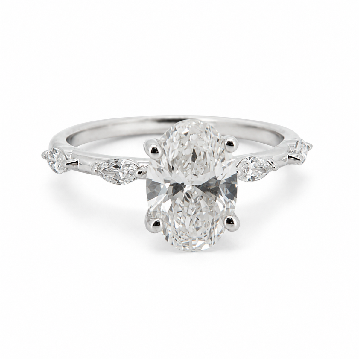 PESO 10080 oval solitaire engagement ring with alternating round and marquise side stones, front three-quarter view, 14K white gold