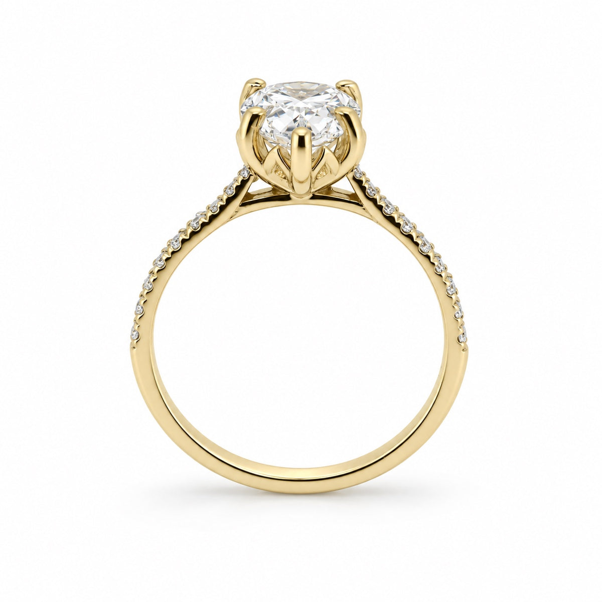 Pear solitaire engagement ring with stone-set band in 14K yellow gold, rear profile view