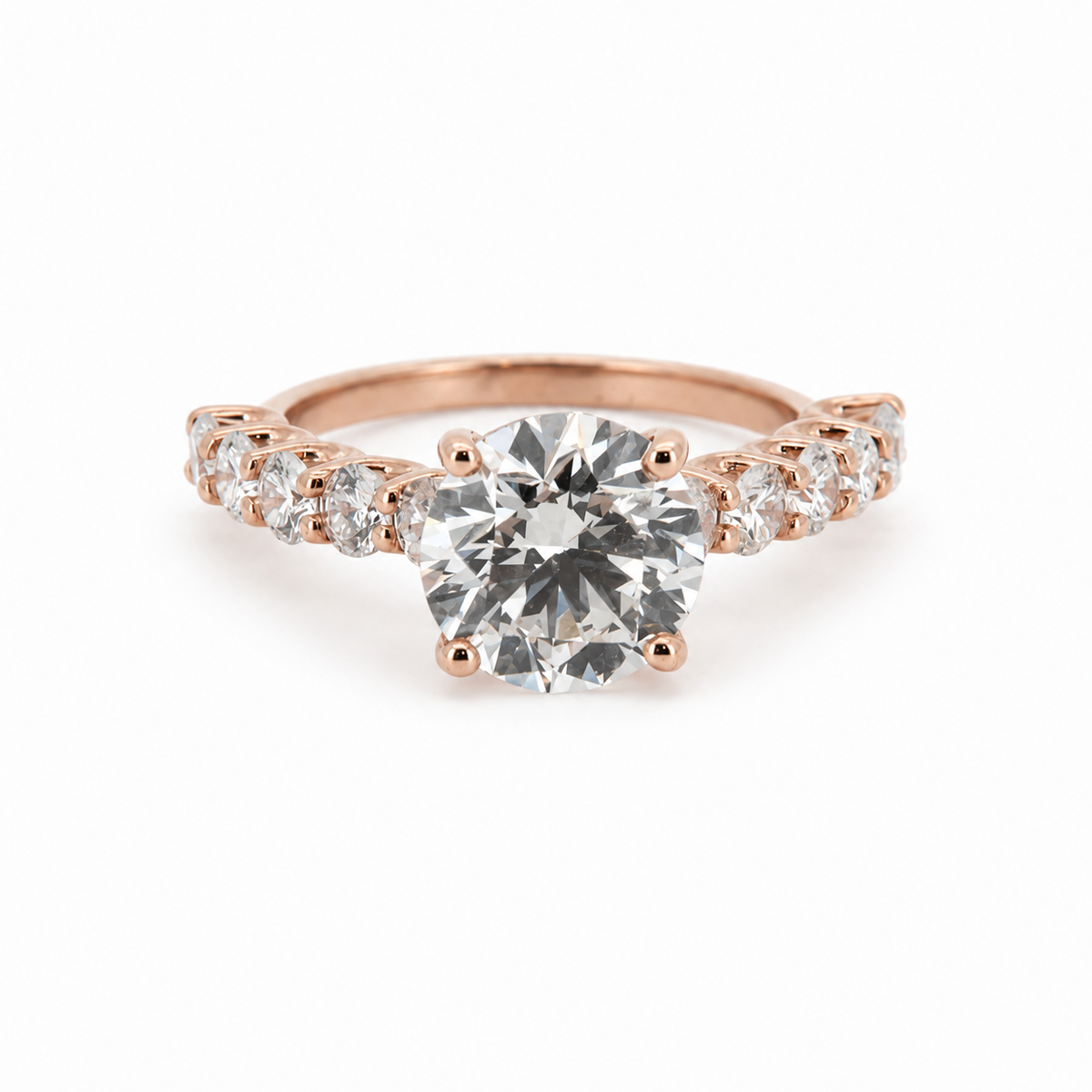 PESO 10085 round solitaire engagement ring with openwork graduated side stones, front view, 14K rose gold