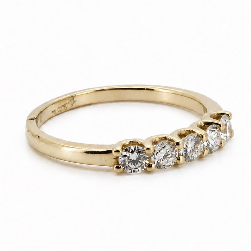 Three-quarter view of the five-stone round 14K yellow gold ring