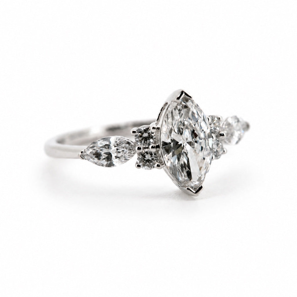 Alternate three-quarter view of the marquise and pear three-stone ring